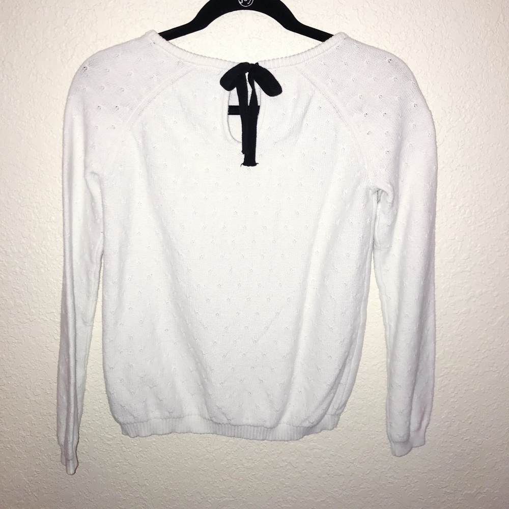White sweater with bow